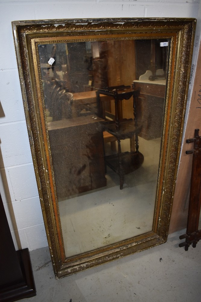 An early 20th Century gilt frame wall mirror, some distressing, approx 132 x 75cm