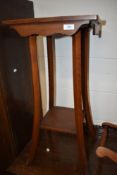 An early 20th century stained frame plant stand