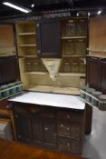 An early 20th century oak 'Easiwork' kitchen cabinet, design num 67639, having panel cupboards and