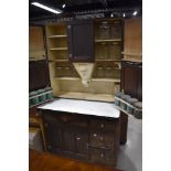 An early 20th century oak 'Easiwork' kitchen cabinet, design num 67639, having panel cupboards and