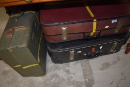 Three vintage suitcases, not leather