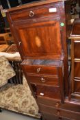 An Edwardian mahogany night cabinet having cupboard over reduced pull 'drawer' base