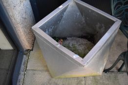 An aluminium planter in the modernist style