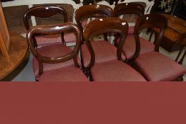 A harlequin set of six mahogany balloon back dining chairs