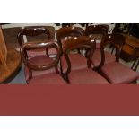 A harlequin set of six mahogany balloon back dining chairs