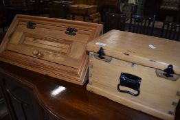 A traditional pine lidded box and a small modern pine corner cupboard