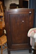 A 19th century mahogany corner wall cupboard, on later feet