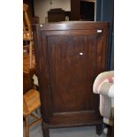 A 19th century mahogany corner wall cupboard, on later feet