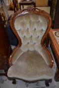 A reproduction stained frame Victorian style spoon back chair