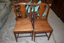 A pair of period oak vase back dining chairs