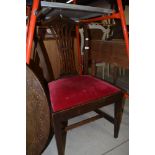 A 19th Century stained frame formal dining chair having red dralon drop in seat