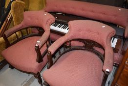 A pair of late Victorian mahogany frame table armchairs, having later russet upholstery, on cabriole