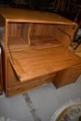 A light Ercol bureau or drinks cabinet, width approx. 82cm