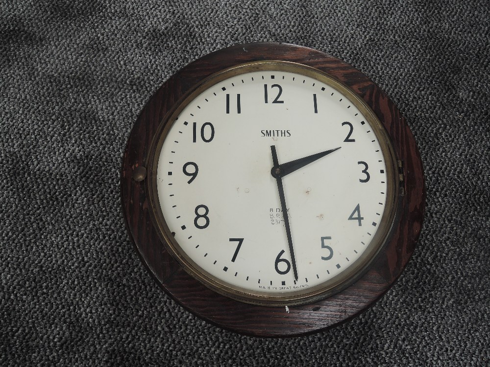 A 20th century Smiths BR (M) 8 Day Railway Station Clock, metal dial set with Arabic numerals,