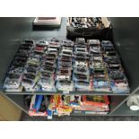 A shelf containing 140 Mattel Hot Wheels diecasts all in blister card packs including 2008 40 year