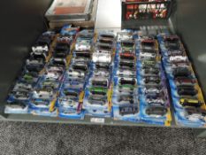 A shelf containing 140 Mattel Hot Wheels diecasts all in blister card packs including 2008 40 year