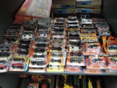 A shelf of modern Matcbox diecasts, all in blister packs, 140 in total