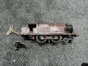 A playworn Hornby 0 gauge clockwork 4-4-2 LMS Locomotive 2323 with key