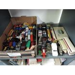 A shelf of mixed vintage diecasts, early Dinky through to modern Corgi including Military.