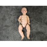 A late 19th century Armand Marseille bisque headed doll having sleep blue eyes, open mouth with