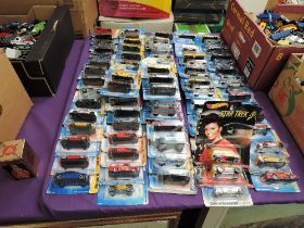 A collection of Mattel Hot Wheels diecasts all in blister card packs including Star Trek 50th