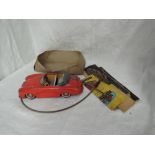 A Distler Western Germany tin plate remote control Electromatic 7500 Porsche Car in red with grey