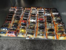 A shelf of modern Matcbox diecasts, all in blister packs, 140 in total