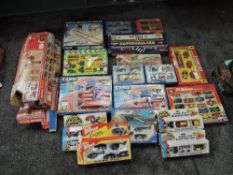 A shelf of modern diecasts and accessories including Matchbox Smash N Crash, Streak Racing Track,