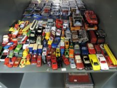 A shelf of playworn mainly 1980's and later diecasts including Matchbox, Corgi etc