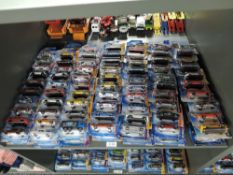 A shelf containing 140 Mattel Hot Wheels diecasts all in blister card packs including 2008 40 year