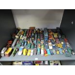 A shelf of playworn diecasts including Matchbox Lesney, Corgi, Dinky etc