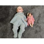 An early 20th century Armand Marseille bisque headed doll having sleep eyes, open mouth with two
