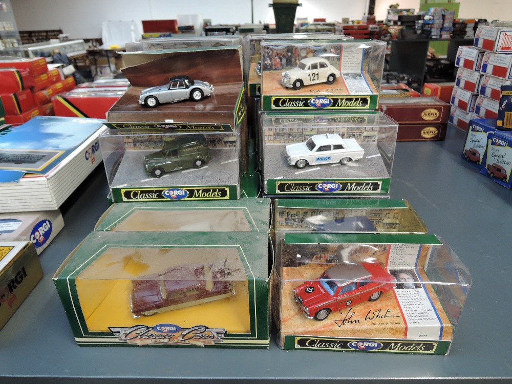 Thirty Corgi Classic diecasts including vintage Rally Cars, Vans, Police etc, all in window