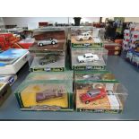 Thirty Corgi Classic diecasts including vintage Rally Cars, Vans, Police etc, all in window