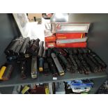 A shelf of 00 gauge Locomotives, Locos & Tenders, Rolling Stock etc including Lima, Hornby,