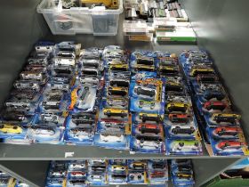 A shelf containing 140 Mattel Hot Wheels diecasts all in blister card packs including 2008 40 year