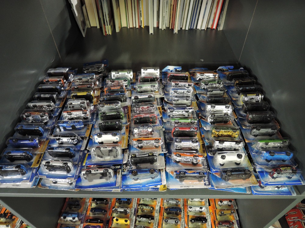 A shelf of modern Mattel and similar Hot Wheels diecasts, all in blister packs, 140 in total