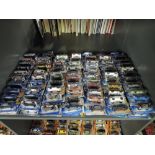 A shelf of modern Mattel and similar Hot Wheels diecasts, all in blister packs, 140 in total