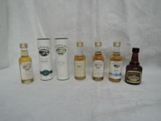Seven Miniature bottles of Bowmore Islay Single Malt Whisky, 10 year old 43% vol in tube, Legend 40%