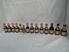 Fifteen Drambuie Miniatures mainly different ages and bottlings, Cork Top White and Red label on