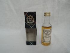 A Gordon & Macphail 50 Year old Old Elgin miniature, Distilled January 1940 Bottled 1990,