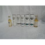 Seven Miniature bottles of Bowmore Islay Single Malt Whisky, 10 year old 43% vol in tube, Darkest