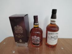 A bottle of Chivas Regal 12 Year Old Blended Scotch Whisky 40% vol, 1 litre in card box and a bottle