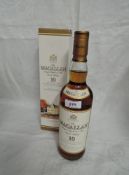 A bottle of Single Malt Whisky, The Macallan 10 Year Old Matured in Selected Sherry Oak Cask from