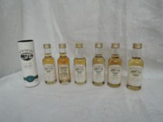 Seven Miniature bottles of Bowmore Islay Single Malt Whisky, Maund's 10 year old Guinness Book of