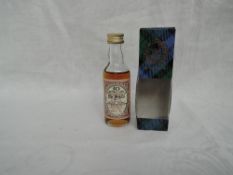 A Gordon & Macphail 50 Year old Macphails miniature, Distilled 6th & 13th December 1937 Bottled 1987