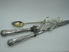 A small selection of HM silver flatware including four coffee spoons with matching sugar shovel, a