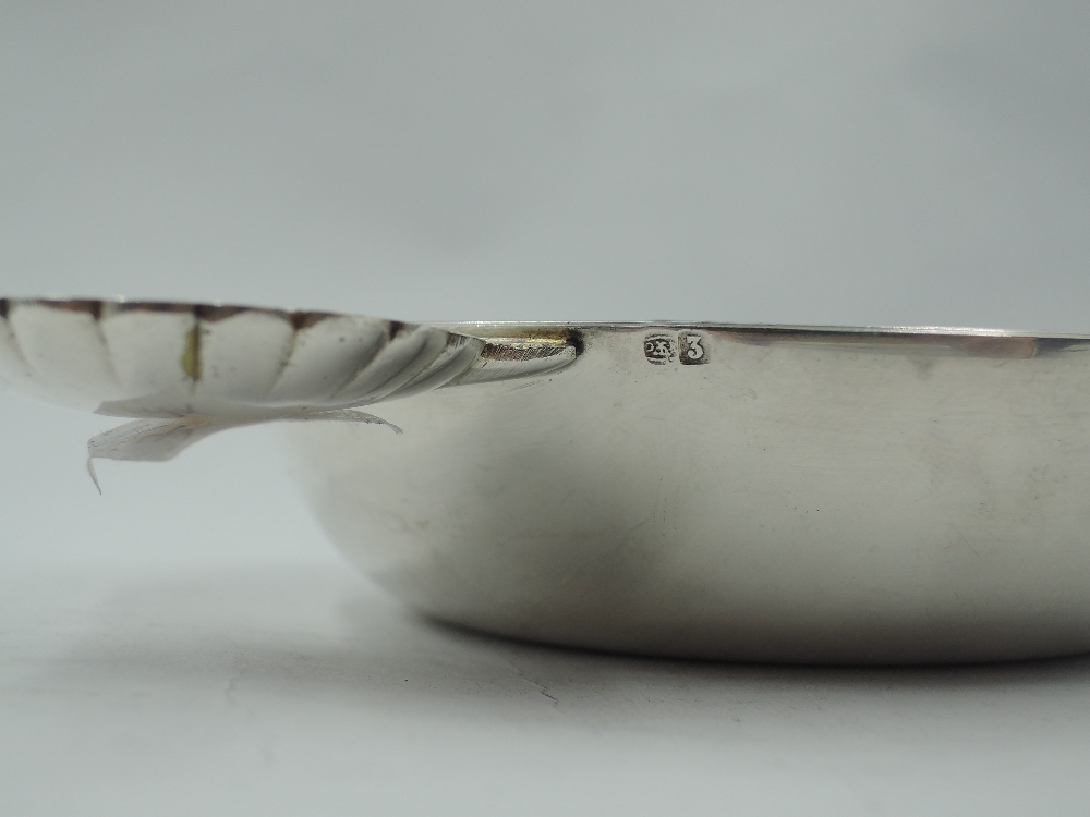 A white metal wine taster of traditional circular form having moulded scallop shell handle, bears - Image 3 of 4