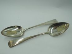 A pair of Georgian silver table spoons of Old English form bearing monogram to terminals, London