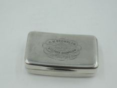 A Georgian silver snuff box of shaped oblong form having gilt interior and later inscription to